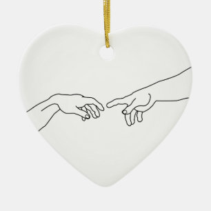 Hands showing the creation of Adam Ceramic Tree Decoration