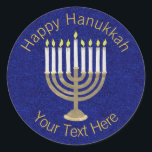 Hanukkah Gold Menorah On Rich Blue Background Classic Round Sticker<br><div class="desc">A classic Hanukiah design in gold and white on a deep blue faux sparkle background features space for your personalised text making this round sticker a unique addition to your Hanukkah celebrations. Use these Hanukkah stickers on mailings, scatter on a gift package or tuck them into favour bags as party...</div>