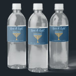 Hanukkah Love & Light Custom Blue Menorah Party Water Bottle Label<br><div class="desc">Cute custom Love and Light Hanukkah party water bottle labels for a Jewish family Chanukah dinner celebration with a synagogue. Personalise this pretty accessory with your own last name or group information in blue under the pretty gold menorah.</div>
