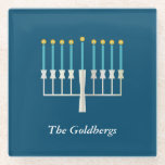 Hanukkah Menorah in Blue Custom Family Name Glass Coaster<br><div class="desc">Celebrate the Festival of Lights with this elegant glass coaster,  featuring a minimalist menorah design on a deep blue background. Perfect for Hanukkah gatherings or as a thoughtful gift,  this coaster can be personalised with your family name,  adding a special touch to your holiday decor.</div>