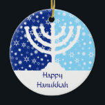 Hanukkah Menorah Ornament<br><div class="desc">The perfect ornament for the interfaith family. A Hanukkah menorah is silhouetted against a field of dark and light blue stars and snowflakes. Your personalised message goes below. Also can be used as  fan,  light or blind pulls or wall decor. Available with matching products.</div>