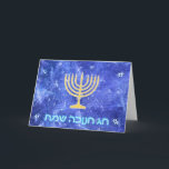 Hanukkah Snowstorm Menorah Holiday Card<br><div class="desc">A glowing gold Hanukkah menorah and "Chag Chanukkah Sameach" (Happy Hanukkah) in glowing blue and white text superimposed on a blue and white fractal image reminiscent of snowflakes in a storm.</div>