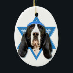 Hanukkah Star of David - Basset Hound - Jasmine Ceramic Ornament<br><div class="desc">What could make saying Happy Hanukkah more fun than having this Basset Hound Dog wearing a Yamaka surrounded by the Star of David. This whimsical holiday design will be sure to delight your friends and family as well as other dog lovers. This design is available in over 100 Dog Breeds....</div>