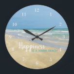 Happiness is a Warm Beach Large Clock<br><div class="desc">Trendy beach house wall clock with beautiful seaside photography featuring a pretty sandpiper standing at the edge of the ocean waves on a sunny summer day. Cute beach house decor for a modern vacation home filled with ocean art. This lovely seashore clock features gorgeous typography and cool white numbers for...</div>