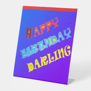 HAPPY BIRTHDAY DARLING TEXT AND BLUE PEDESTAL SIGN