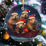 Happy Capybara Christmas  Ceramic Ornament<br><div class="desc">This design may be personalised by choosing the Edit Design option. You may also transfer onto other items. Contact me at colorflowcreations@gmail.com or use the chat option at the top of the page if you wish to have this design on another product or need assistance. See more of my designs...</div>