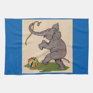 happy elephant playing with rope and ball tea towel