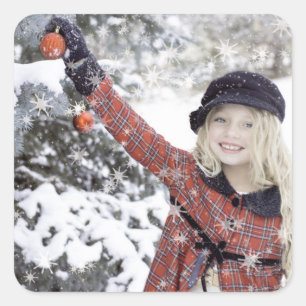 Happy girl decorating Christmas tree Square Sticker