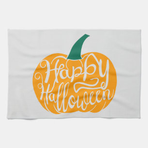 Happy Halloween lettering on carved pumpkin Tea Towel
