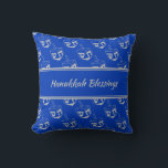 HAPPY | HANUKKAH BLESSINGS | Dreidel BLUE Cushion<br><div class="desc">Mid blue THROW PILLOW to celebrate HANUKKAH. Blue and silver grey colour theme with all over DREIDEL print. There is customisable placeholder text on the front which says HANUKKAH BLESSINGS and on the back so you can personalise with your own greeting and/or name. Other versions available in the HANUKKAH Collection...</div>