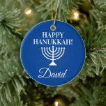 Happy Hanukkah blue menorah custom Jewish Holiday Ceramic Ornament<br><div class="desc">Happy Hanukkah blue menorah custom Jewish Holiday Christmas tree ornament. Add your own custom name,  greeting or monogram letters. Personalised design for Jewish Holidays. Elegant x-mas decorations with religious candle holder symbol. Upload your own family photo on back optionally. Includes gold glitter string.</div>
