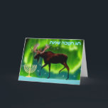Happy Hanukkah - Northern Lights Moose Holiday Card<br><div class="desc">Chanukkah greetings from the Frozen Chosen. A Chanukkah menorah and an ever so slightly stylised image of a moose silhouetted against the Northern Lights.  Hebrew text reading,  "חנוכה שמח חג" (Chag Chanukkah Sameach - Happy Hanukkah) appears in in glowing blue and white.</div>
