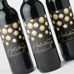 Happy Holidays Gold Christmas Ornaments Black Wine Label<br><div class="desc">Happy Holidays and your names accented by elegant gold and white Christmas tree ornaments on a black background. Personalise these wine bottle labels to give as gifts or to serve at your holiday dinner party,  corporate Christmas party,  holiday wedding engagement party and more. MATCHING items in our collection.</div>