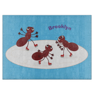 Happy red ants ice skating cartoon cutting board