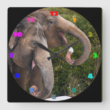 Happy smiling cute elephants playing in the snow.