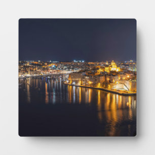 Harbour in Malta illuminated at night Plaque