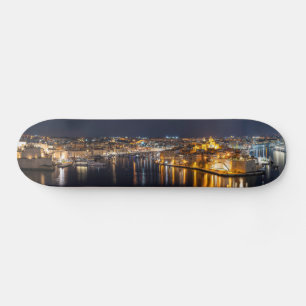 Harbour in Malta illuminated at night Skateboard