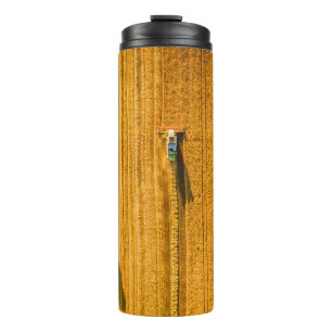 Harvester machine working in field. Combine harves Thermal Tumbler