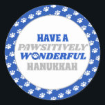 Have a Pawsitively Wonderful Hanukkah Classic Round Sticker<br><div class="desc">Introducing our delightful Hanukkah design featuring a charming border of white paw prints on a blue background. Embrace the festive spirit of Hanukkah with this design, which encloses a clean white background showcasing the heartfelt text "Have a pawsitively wonderful Hanukkah." The text is presented in blue and silver colours, with...</div>