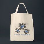 Hawaiian Holly Hanukkah Blue Floral Tote Bag<br><div class="desc">Hau’oli Hanukaha is Hawai'ian for Happy Hanukkah! This illustration showcases a tropical interpretation of holly in Hanukkah colours and subtle gradients. The lettering is dusted with snow for an added surprise. For that special chef in your life,  this original illustration is shown here on the cotton grocery tote.</div>