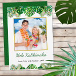 Hawaiian Mele Kalikimaka Christmas Lights Photo Holiday Card<br><div class="desc">This fun, modern holiday card design features lush tropical beach foliage on the front, including palm fronds and monstera philodendron leaves, decorated with glowing multicolored lights, at the top and bottom. In the middle is a customizable gold-edged square photo that you can replace with your own. Below the photo are...</div>