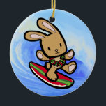 Hawaiian Surfing Bunny Holiday Cartoon Ceramic Ornament<br><div class="desc">There is nothing better than a tropical vacation during the winter holidays! And even better, our adorable surfing bunny, Coco takes on the big waves on the North Shore of Oahu, Hawaii. He brings with him the Aloha sprit for the holidays and wishes you a "Mele Kalikimaka" (Merry Christmas). This...</div>