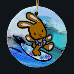 Hawaiian Surfing Bunny Holiday Cartoon Ceramic Ornament<br><div class="desc">There is nothing better than a tropical vacation during the winter holidays! And even better, our adorable surfing bunny, Coco takes on the big waves on the North Shore of Oahu, Hawaii. He brings with him the Aloha sprit for the holidays and wishes you a "Mele Kalikimaka" (Merry Christmas). This...</div>