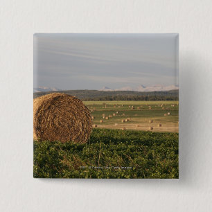 Hay Bales In A Field With Mountains At Sunrise 15 Cm Square Badge