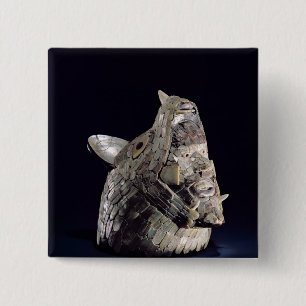Head of an animal with human head in open jaws 15 cm square badge