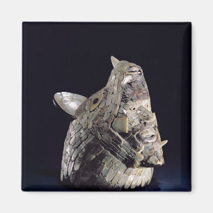 Head of an animal with human head in open jaws magnet