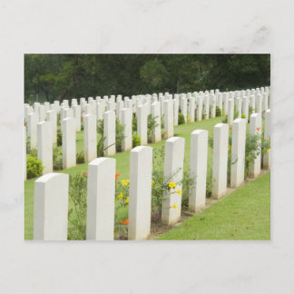 Headstones in a war cemetery postcard