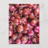 Heap of red onions on market