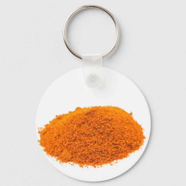 Heap of spice cayenne pepper powder on white key ring (Front)
