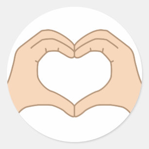 Heart from hands isolated on a white background classic round sticker