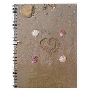 heart in the sand with shells notebook