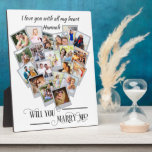 Heart Photo Collage Love You Marry Me Plaque<br><div class="desc">Heart Shaped photo collage plaque with 20 of your favourite photos. Will You Marry Me? is lettered in elegant swirly calligraphy and your photos are displayed in square format on snapshot style backgrounds in a heart shape picture montage. You can also add your personalised text at the top, such as,...</div>