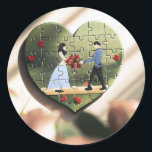 Heart Puzzle Romantic Sticker<br><div class="desc">Add a touch of romance to your projects with this heart-shaped puzzle sticker. Featuring a delightful illustration of a couple exchanging flowers, surrounded by red hearts and set against a serene green background, this sticker is perfect for wedding invitations, romantic gift wraps, scrapbooking, or as a sweet personal touch to...</div>