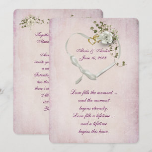 Heart ribbon and wedding rings on pink invitation