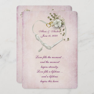 Heart ribbon and wedding rings on pink invitation