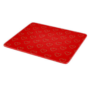 Heart shaped hearts on red cutting board