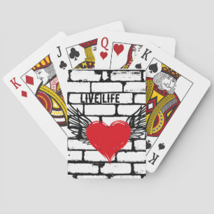Heart with wings /brick wall, playing cards