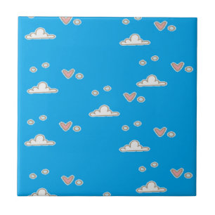 Hearts and clouds on blue ceramic tile