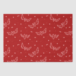 Hearts and wings on red tissue paper