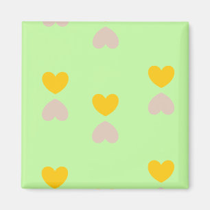Hearts shapes on light green magnet