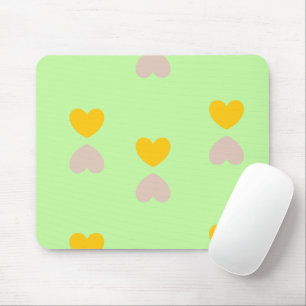 Hearts shapes on light green mouse pad