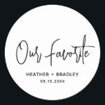 Heather Elegant Black White Minimal Modern Wedding Classic Round Sticker<br><div class="desc">Modern wedding favour stickers featuring a simple design with "Our Favourite" in an elegant script typography along with your names and wedding date in a minimalist sans serif font. All design elements are in black and white. A chic design for any style of wedding. These custom stickers are great for...</div>