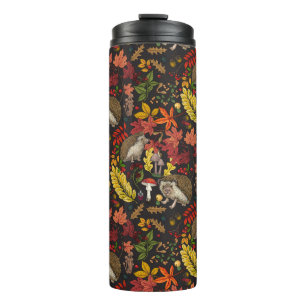 Hedgehogs and autumn forest flora on black thermal tumbler
