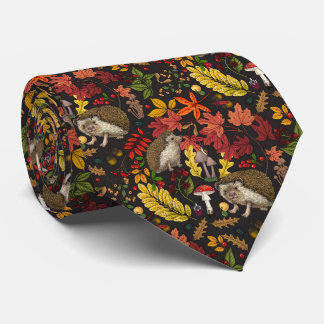 Hedgehogs and autumn forest flora on black tie