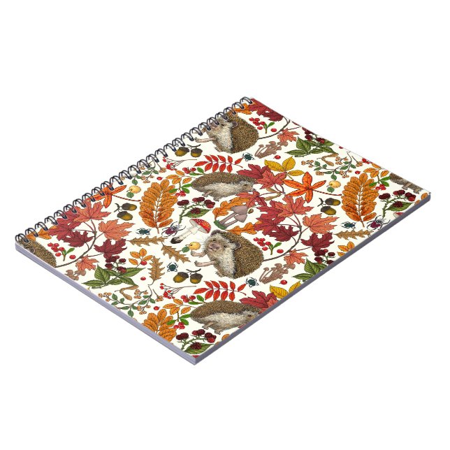 Hedgehogs and autumn forest flora on ivory notebook (Left Side)