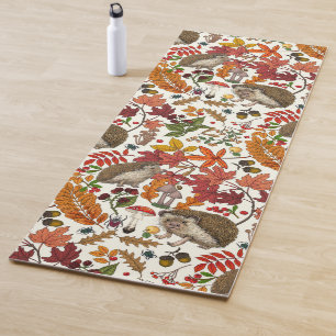 Hedgehogs and autumn forest flora on ivory yoga mat